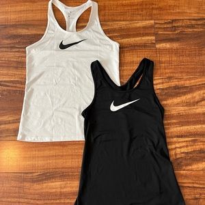 2 Nike tank tops.